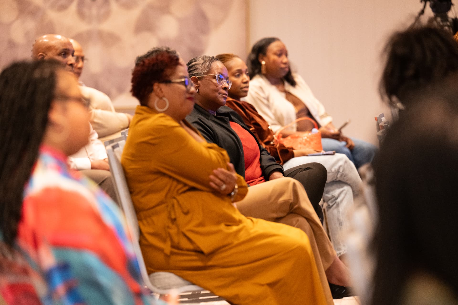 Attendees listening intently during a session at UNPLUG 2026