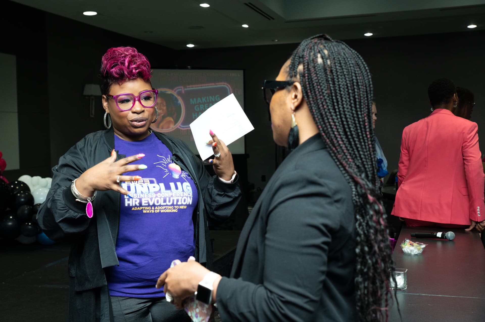 LaShawn in conversation with an attendee